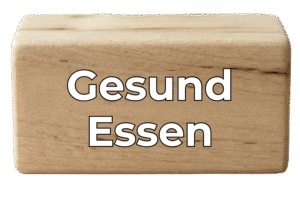 Holzblock mit dem Text "Gesund Essen"