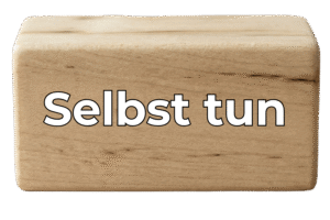 Holzblock mit dem Text "Selbst tun"