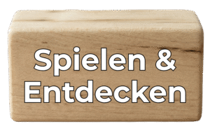 Holzblock mit dem Text "Spielen & Entdecken"